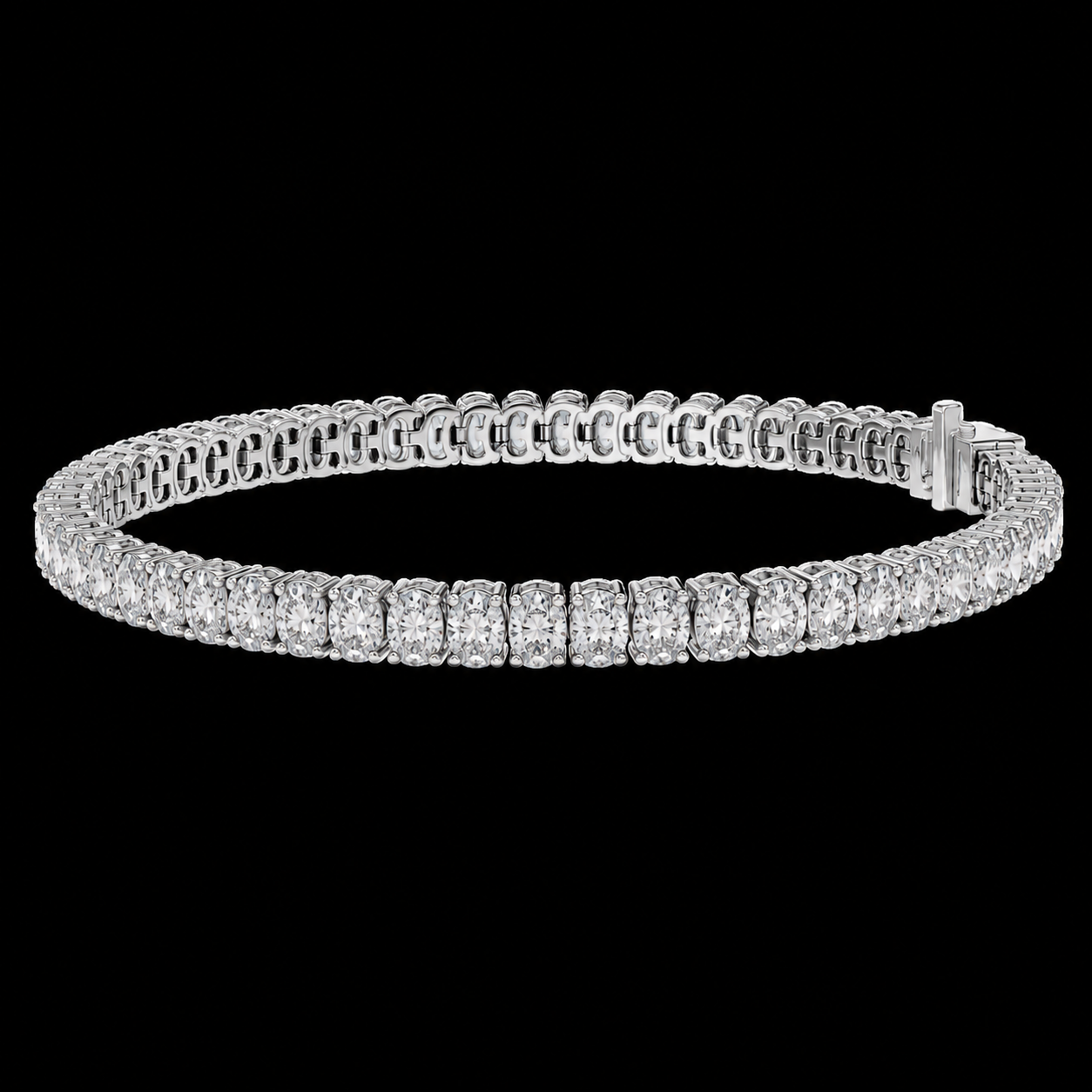 A diamond tennis bracelet in a silver-toned metal setting, displayed against a solid black background.