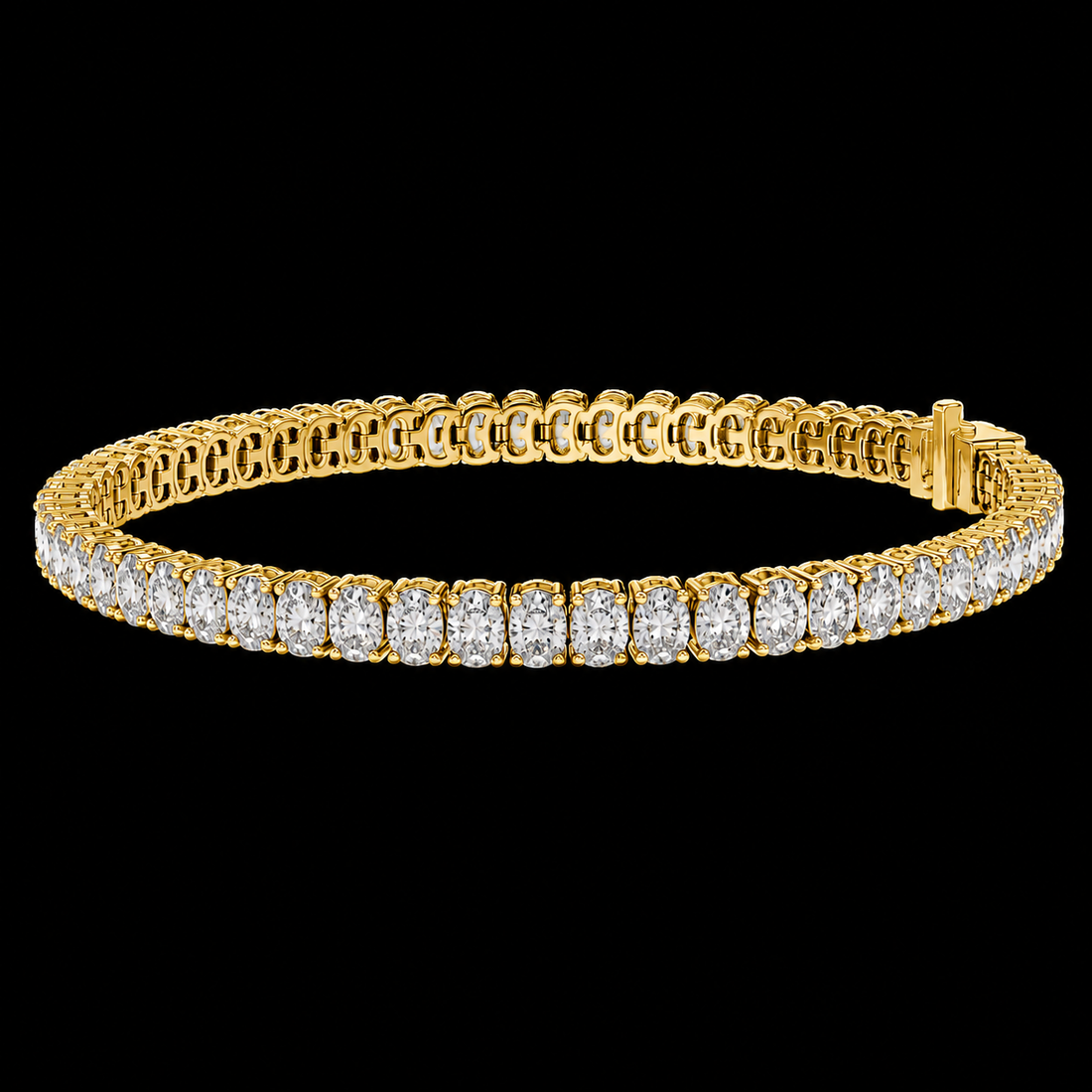 A yellow gold tennis bracelet featuring a continuous row of round-cut diamonds on the front, displayed against a solid black background.
