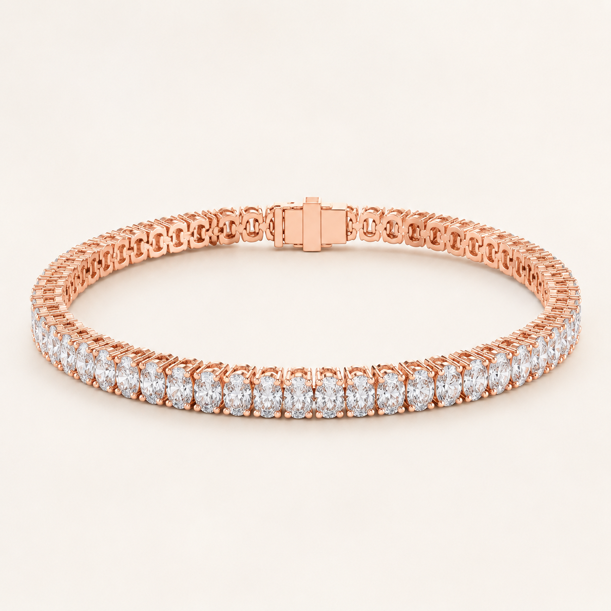 A rose gold tennis bracelet with a continuous row of round-cut clear gemstones, displayed on a clean, light beige background.