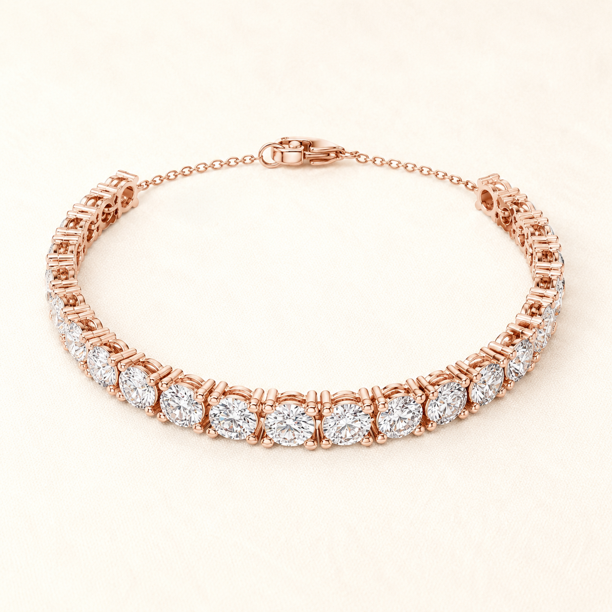 A rose gold tennis bracelet featuring round-cut clear gemstones in a prong setting, displayed on a light cream background.