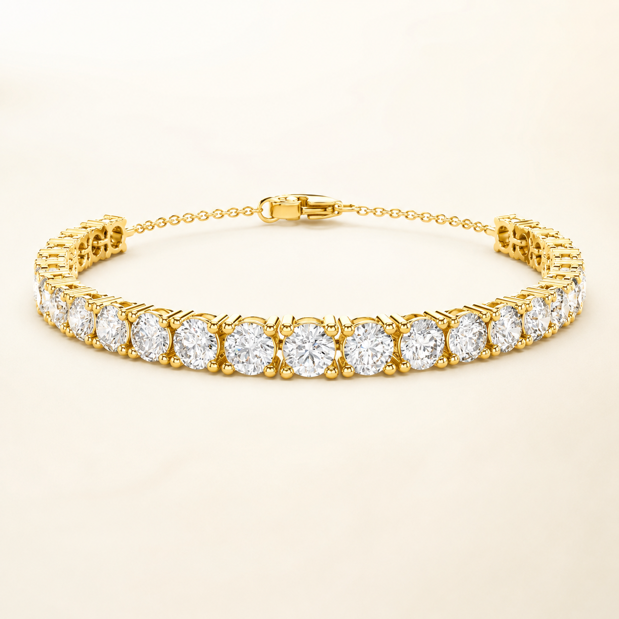 A yellow gold tennis bracelet featuring a row of round-cut clear gemstones in a prong setting, displayed on a clean, light beige background.