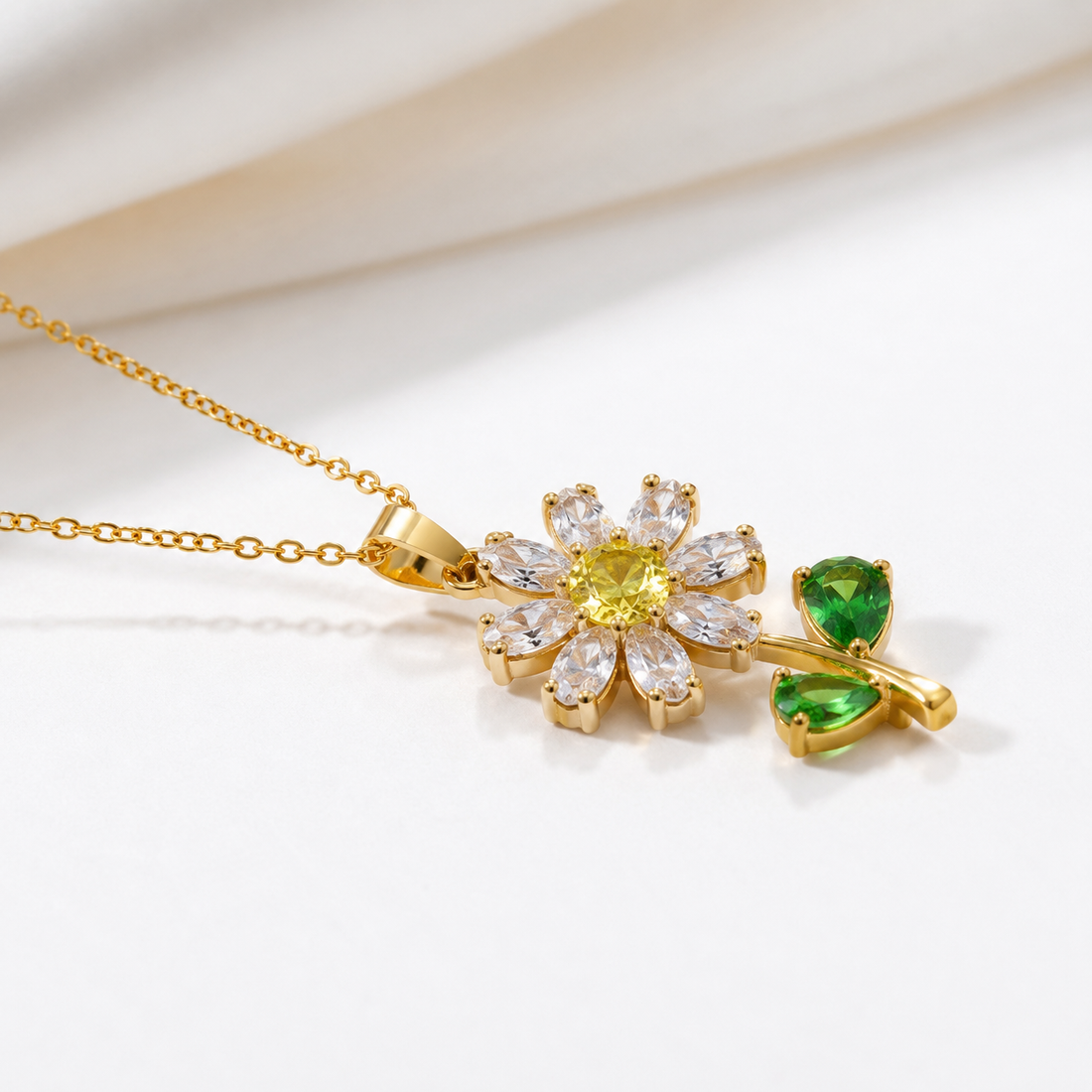Luxury lab-grown diamond flower pendant in yellow gold with marquise petals and green accents by Kiashaa Jewellery