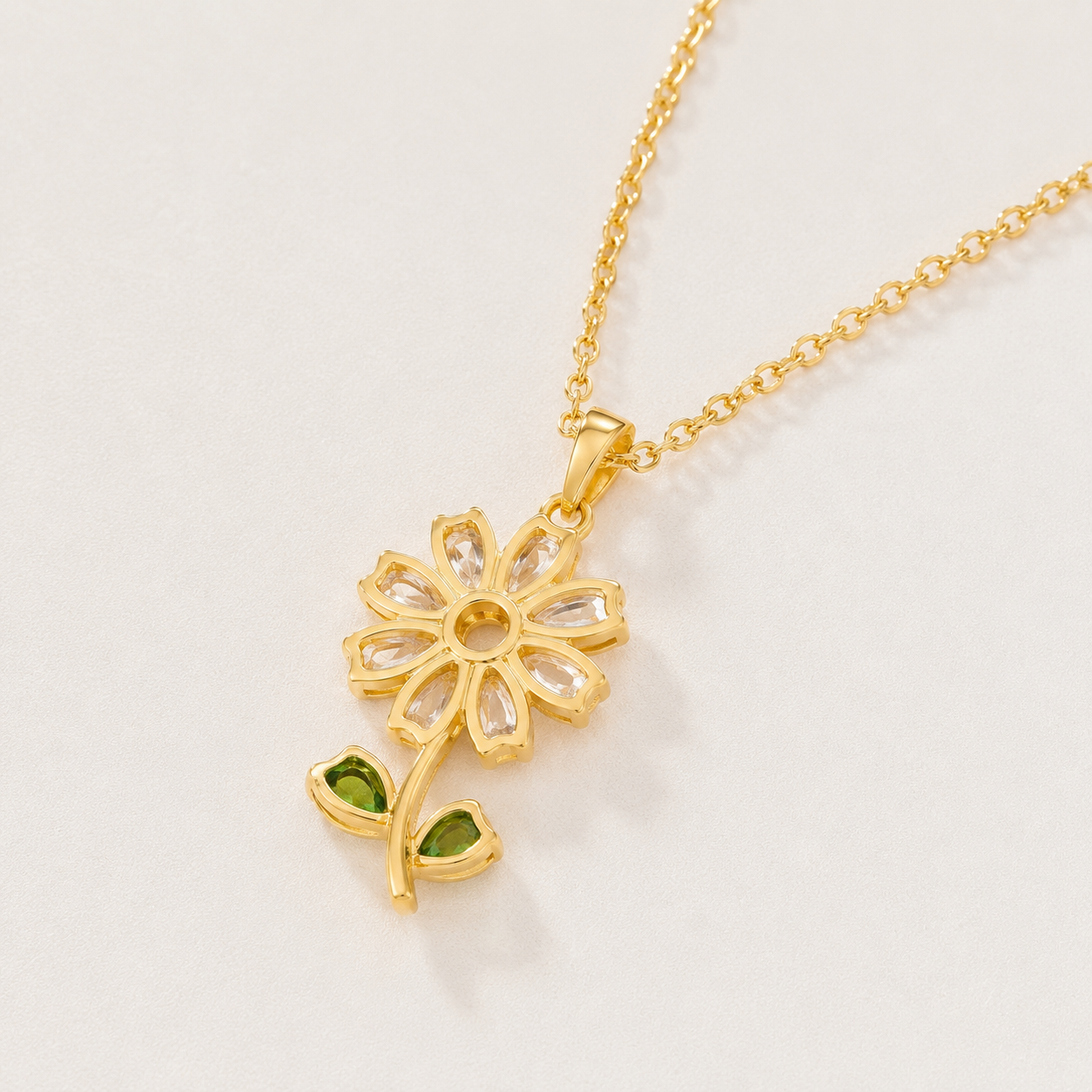 Kiashaa Jewellery yellow gold lab-grown diamond flower pendant featuring clear marquise petals and green leaves