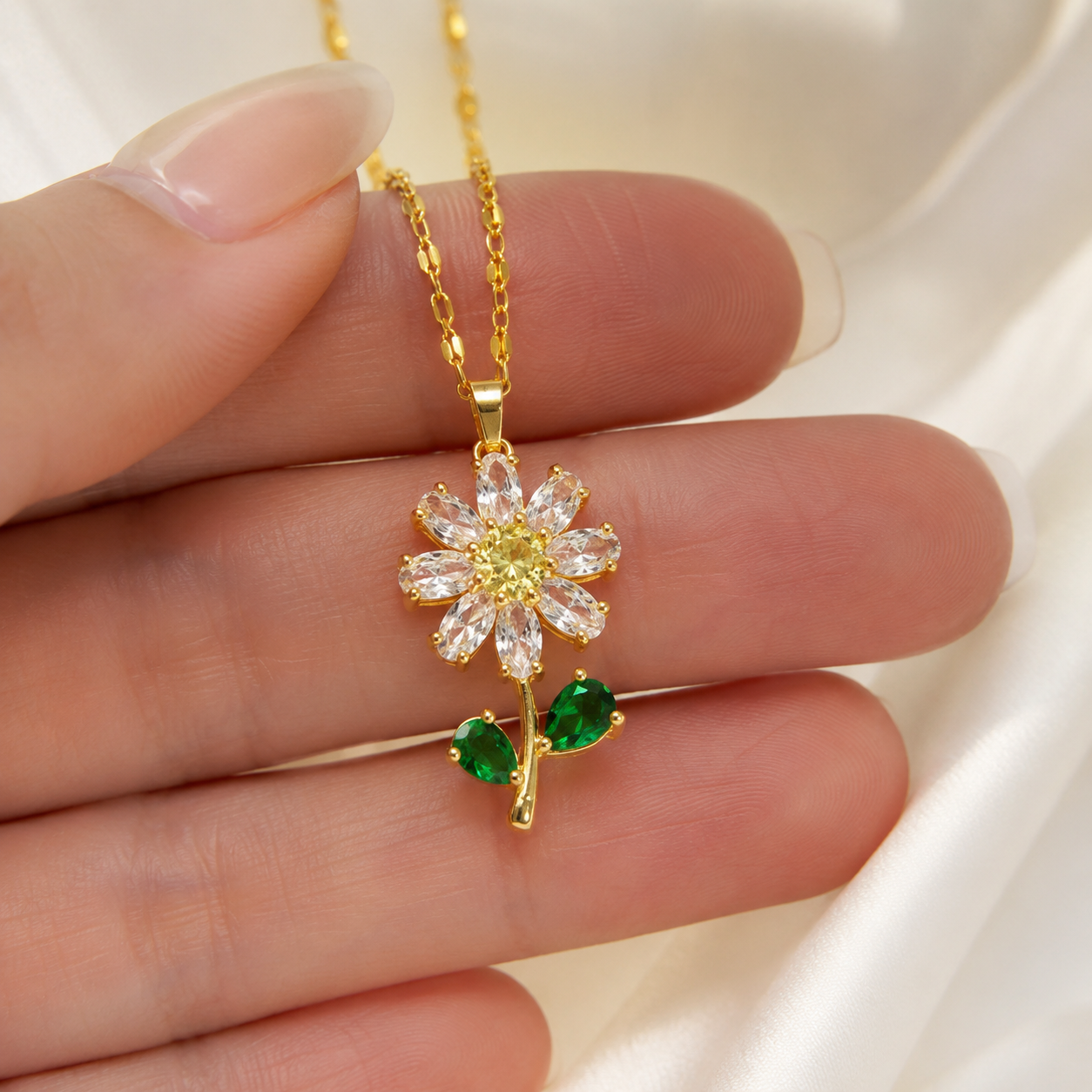 Nature-inspired lab-grown diamond flower pendant in yellow gold with pear-shaped leaves by Kiashaa Jewellery