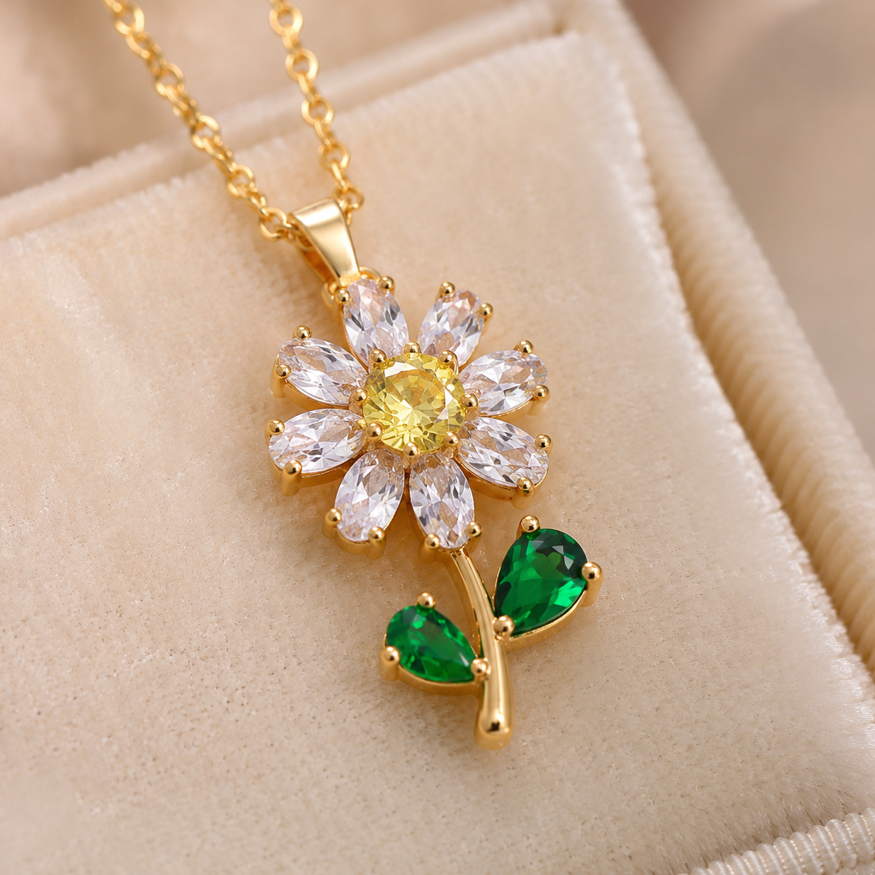 Yellow gold lab-grown diamond flower pendant with a yellow centre and green pear leaves by Kiashaa Jewellery