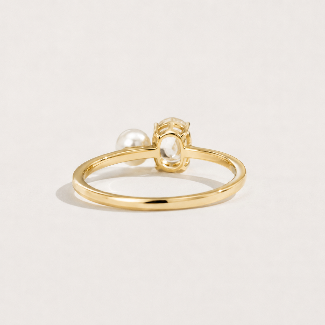 Kiashaa Jewellery 0.5 CT oval lab-grown diamond and pearl ring in yellow gold with a minimalist fine-jewellery look