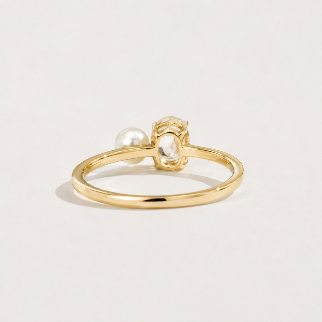Kiashaa Jewellery 0.5 CT oval lab-grown diamond and pearl ring in yellow gold with a minimalist fine-jewellery look