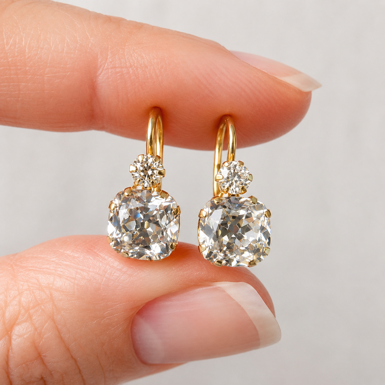 Luxury lab-grown diamond drop earrings in yellow gold with cushion and round stones by Kiashaa Jewellery