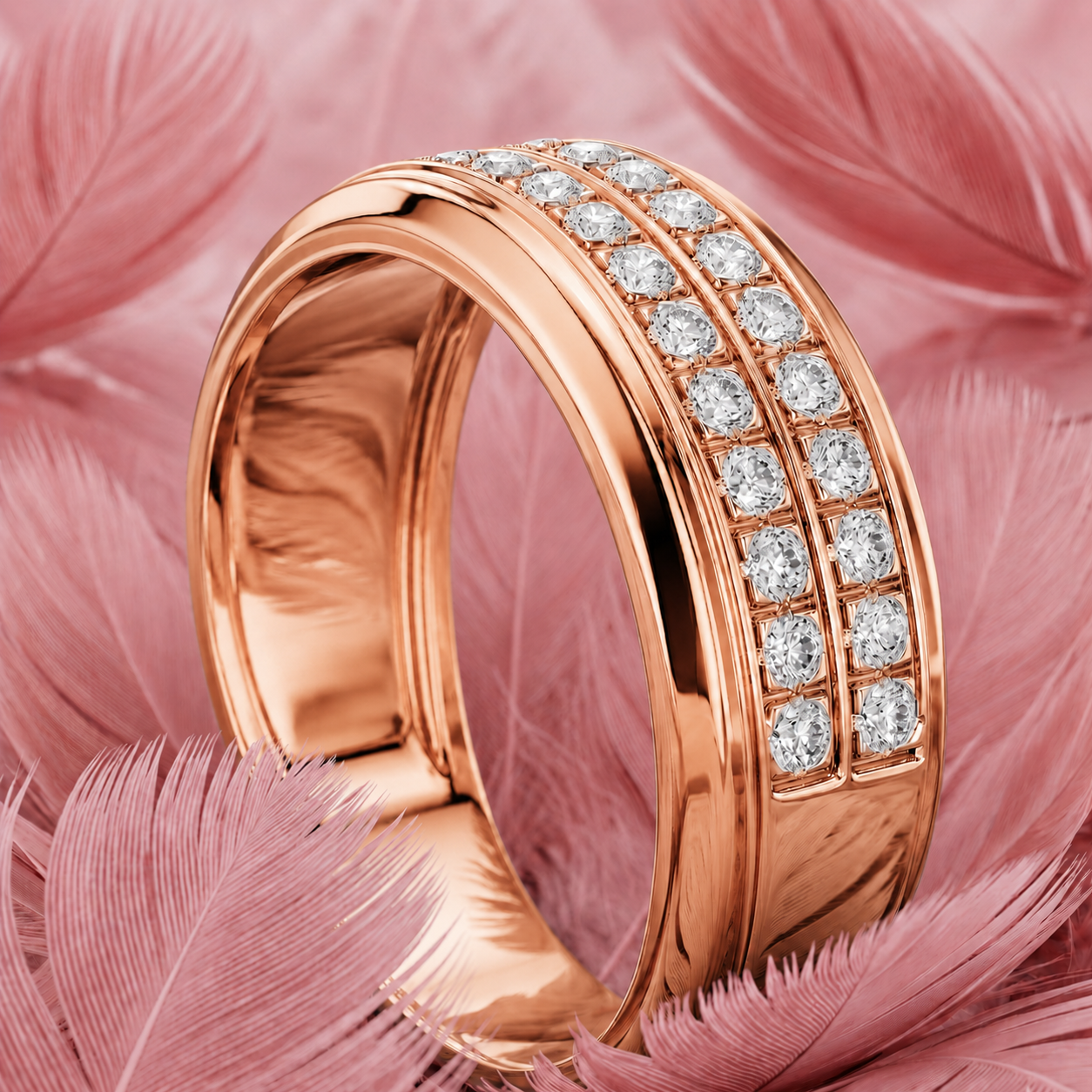 A rose gold band ring with three rows of round-cut clear gemstones, displayed on a bed of soft pink feathers.