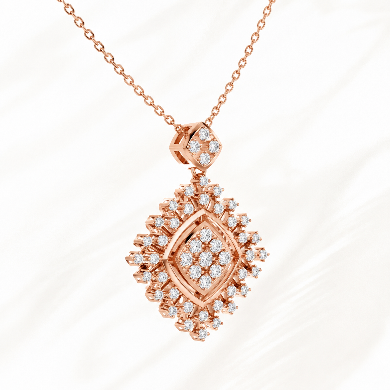 Rose gold diamond pendant necklace with a geometric diamond-shaped design, featuring multiple round-cut diamonds, shown on a white marble background.