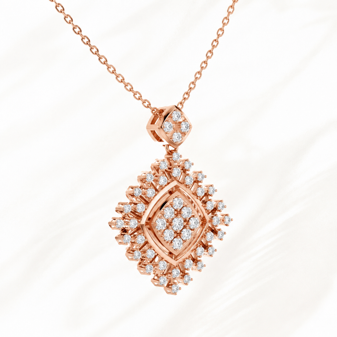 Rose gold diamond pendant necklace with a geometric diamond-shaped design, featuring multiple round-cut diamonds, shown on a white marble background.