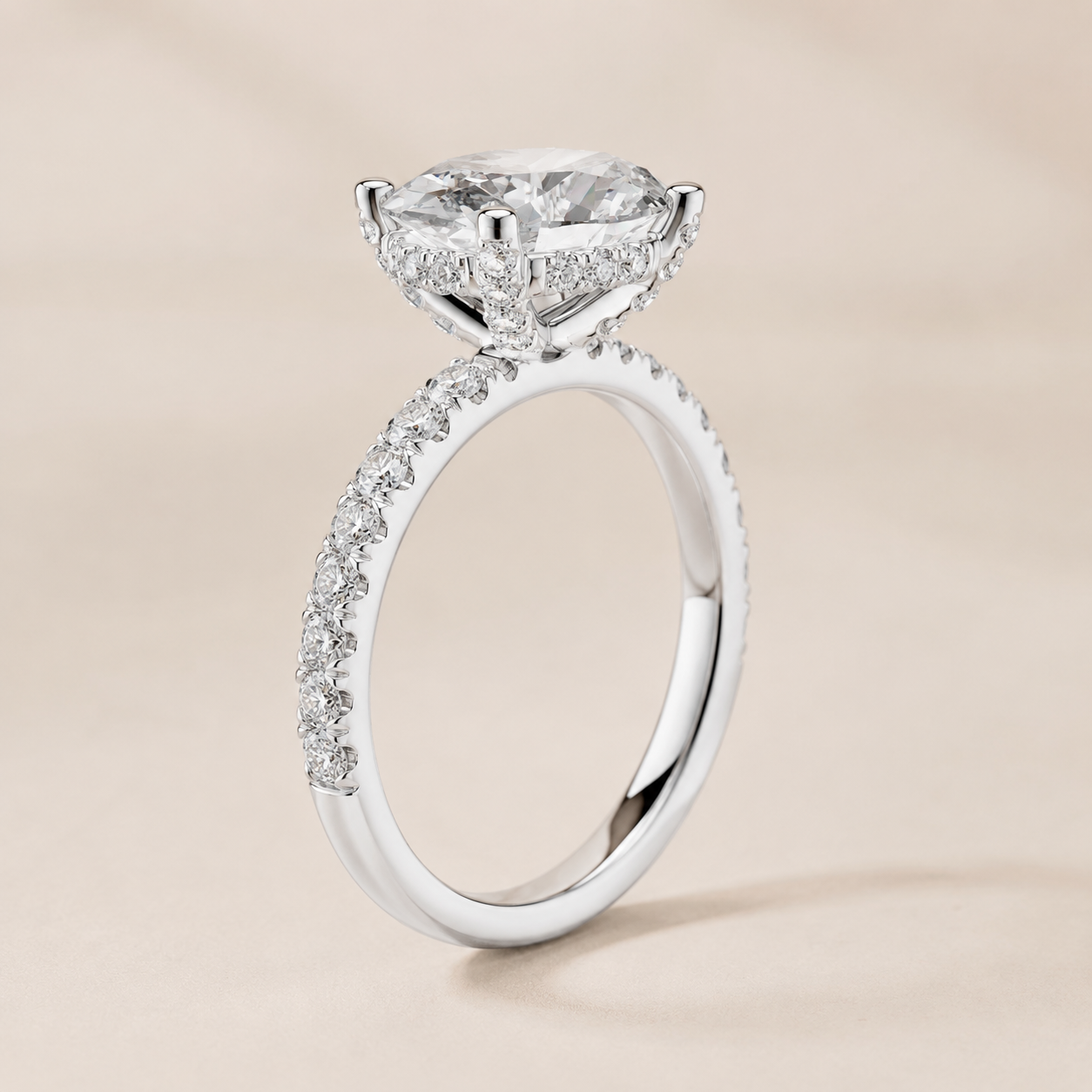 White gold oval diamond engagement ring by Kiashaa Jewellery featuring a 2 CT centre and hidden halo