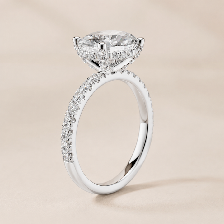 White gold oval diamond engagement ring by Kiashaa Jewellery featuring a 2 CT centre and hidden halo