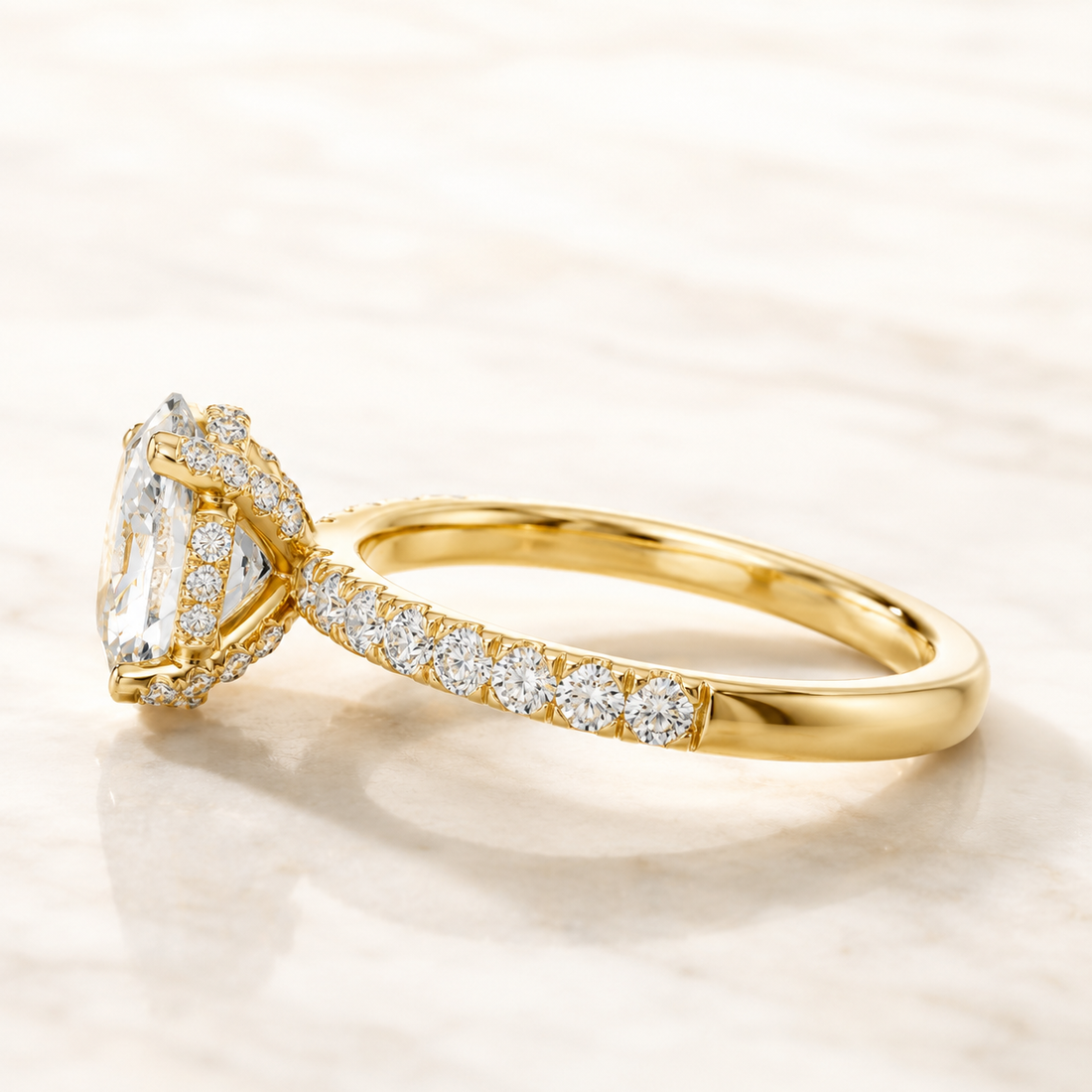 White gold oval diamond engagement ring by Kiashaa Jewellery featuring a 2 CT centre and hidden halo