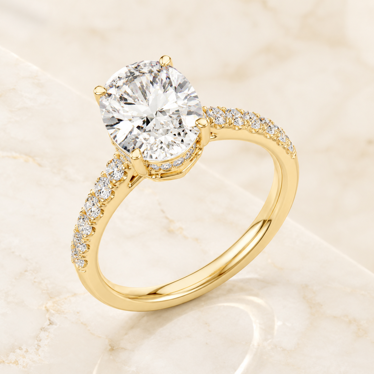 A yellow gold solitaire engagement ring with a round brilliant-cut center stone and a pavé-set diamond band, displayed on a light beige marble surface.