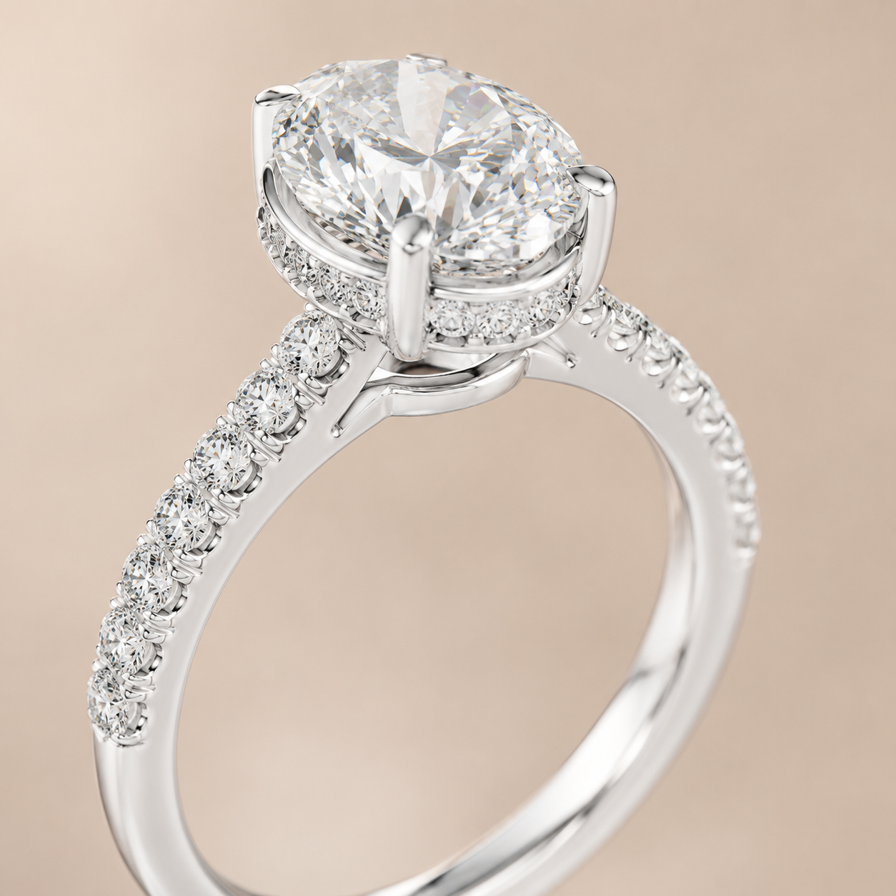 A silver-toned diamond engagement ring with a large oval center stone, a halo of small diamonds, and a pavé-set band, shown on a soft beige background.