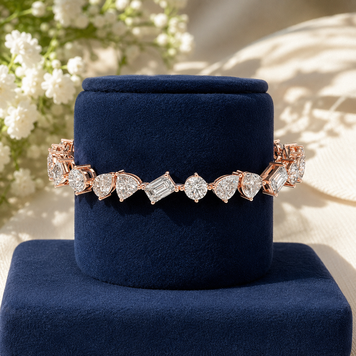 Luxury multi-shape diamond bracelet featuring heart, pear and emerald cuts by Kiashaa Jewellery.