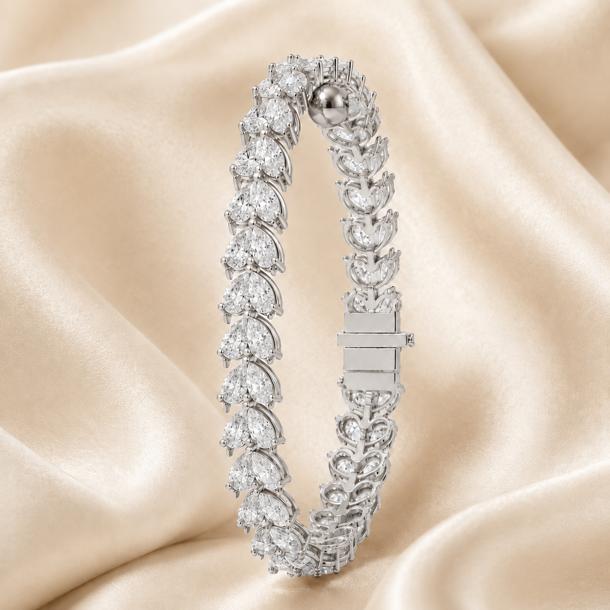 A silver-toned diamond tennis bracelet with marquise and round-cut diamonds, displayed on draped champagne satin fabric.