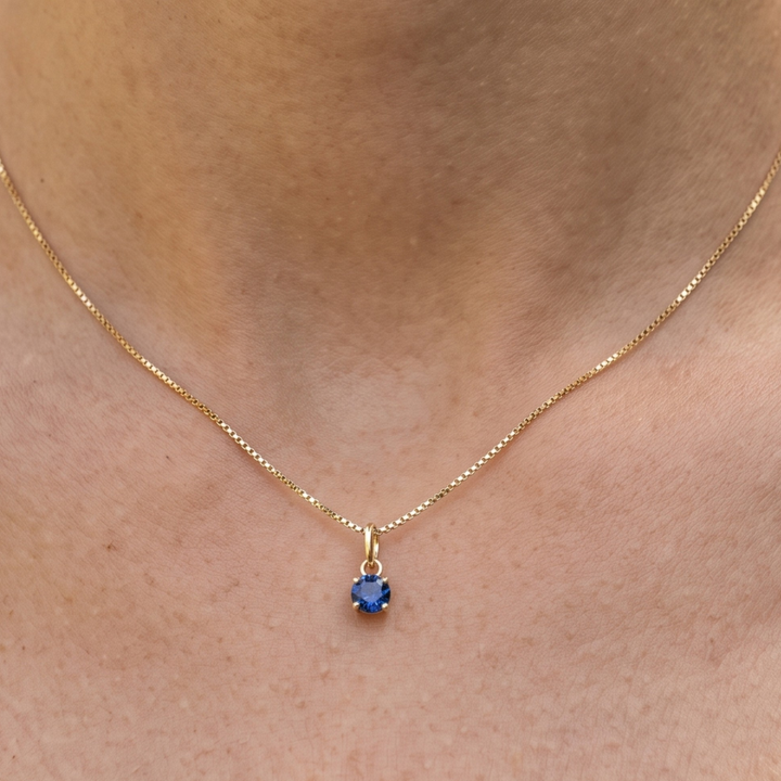 Celestial Blue 0.84 CT round solitaire pendant by Kiashaa Jewellery featuring a 6 mm blue center stone in yellow gold.