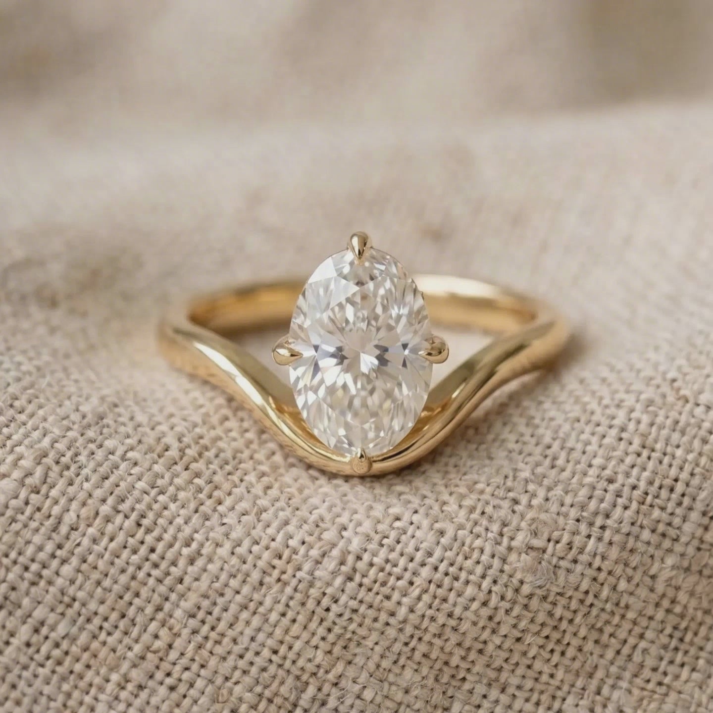 Four-prong oval diamond solitaire proposal ring for women