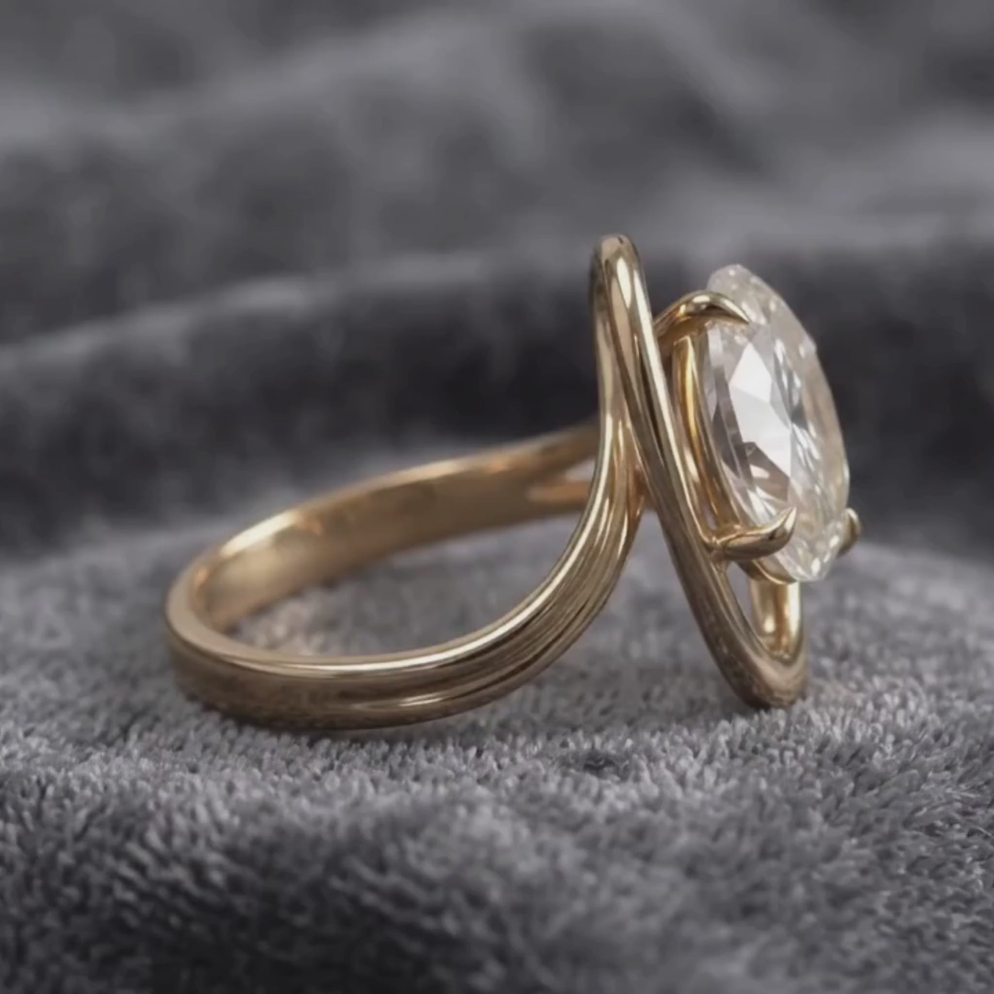 Large oval diamond engagement ring with sculptural bypass bandLarge oval diamond engagement ring with sculptural bypass band